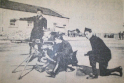 Sean Clarke (standing) giving a lesson to other troops